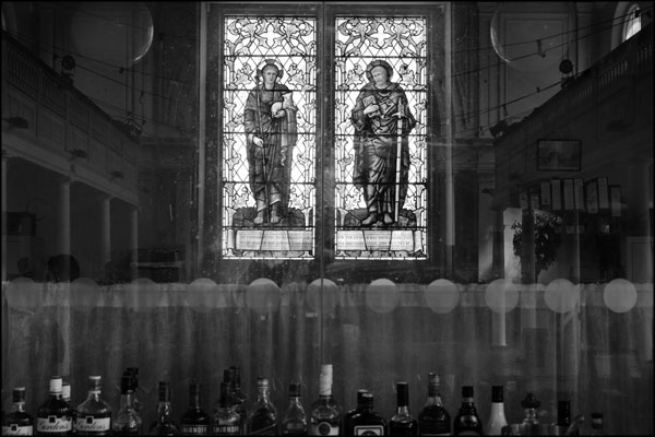 Stained glass window behind the bar, Hammerdown Festival 2022, by Greig Clifford