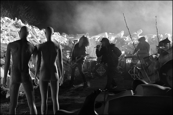 The performance continues while the mannequins watch on. Photography by Greig Clifford