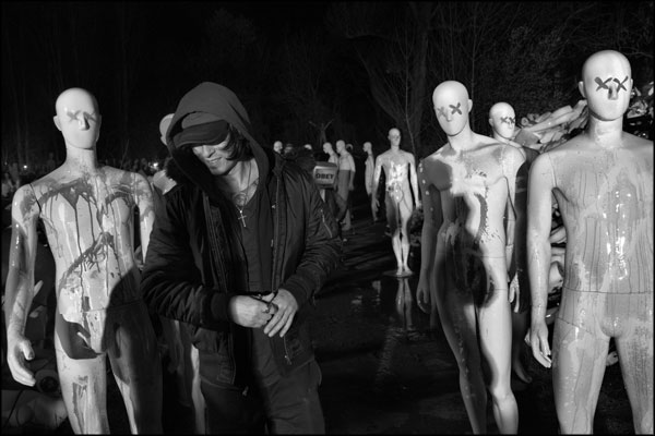 Between takes... A smiling singer, OC Preciado, and paint daubed mannequins. Photography by Greig Clifford