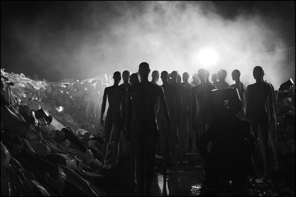 As smoke fills the air, the gathering crowd of mannequins grows larger. Photography by Greig Clifford